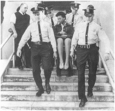 Doris Jean Castle, CORE MEMBER, removed from City Hall in 1963 demonstration after refusing to leave council chamber. Courtesy New Orleans Ti.jpg