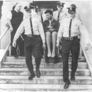 Doris Jean Castle, CORE MEMBER, removed from City Hall in 1963 demonstration after refusing to leave council chamber. Courtesy New Orleans Ti.jpg